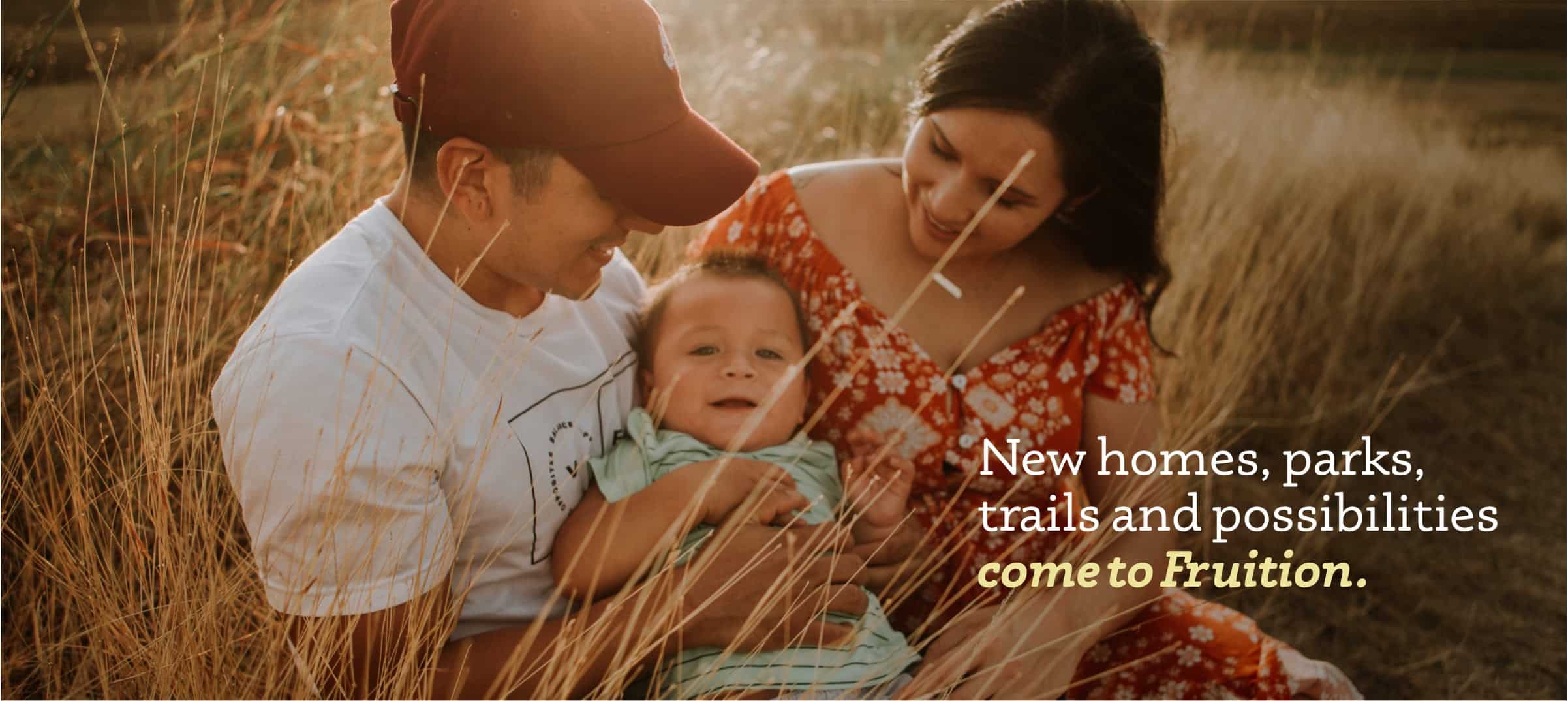 A family of three in a scenic park, embodying the essence of new homes, parks, and opportunities for growth.